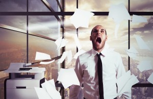 Businessman stressed and overworked yelling in office